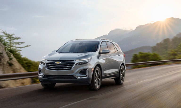 2024 Chevy Equinox Exterior Driving Through Sunny Hills